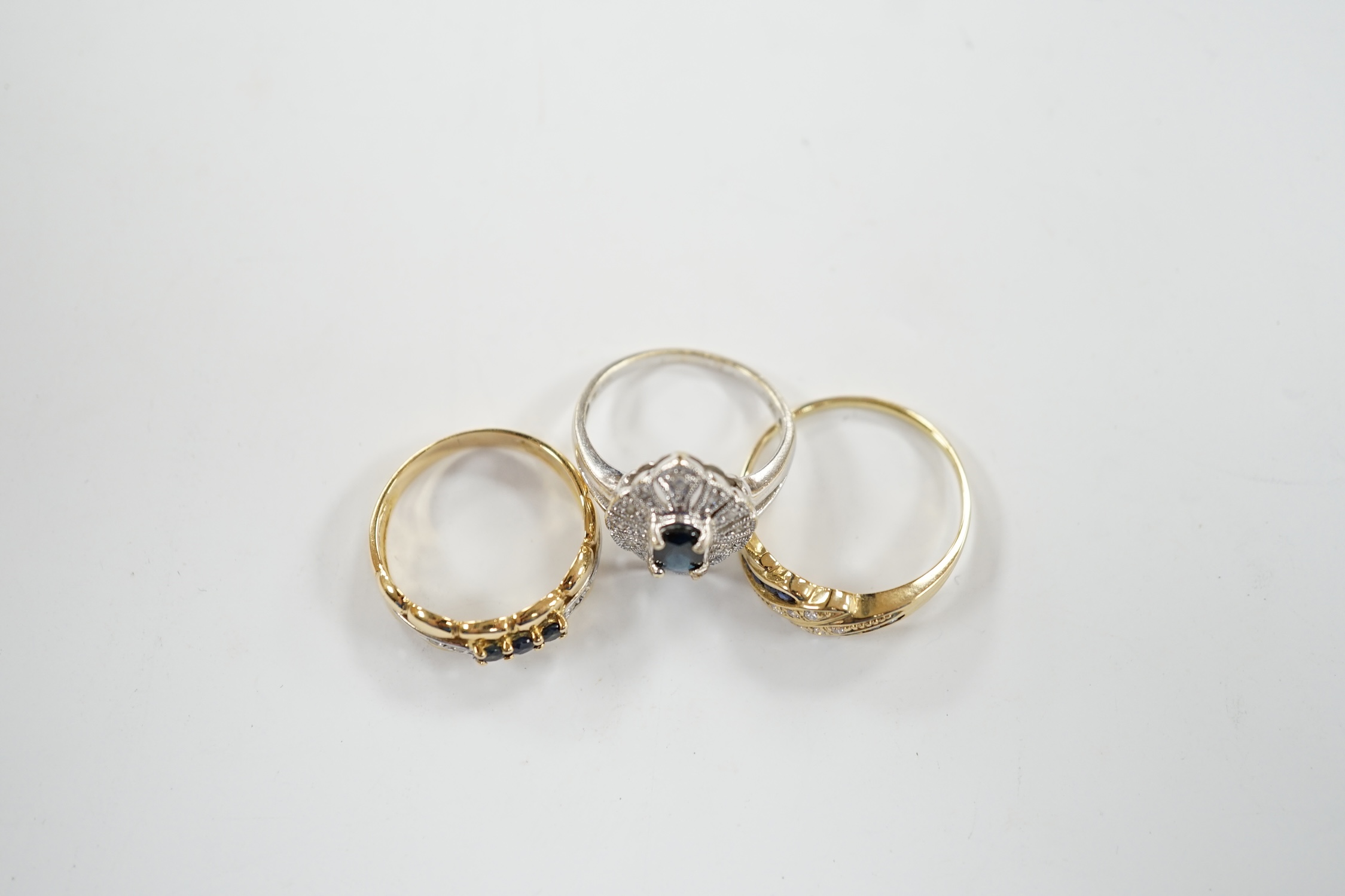 Three assorted 18k, sapphire and diamond chip set rings, including one French ring, gross weight 8.6 grams.